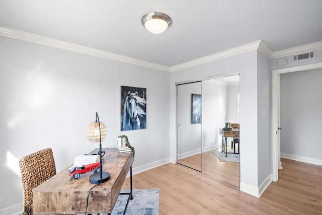 office featuring light hardwood / wood-style flooring and ornamental molding