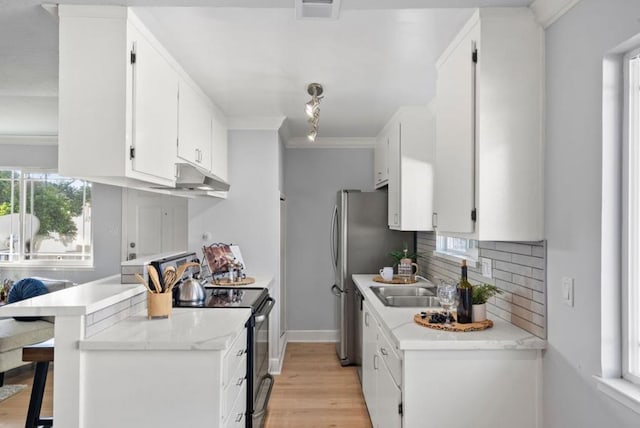 kitchen with white cabinetry, sink, a breakfast bar area, and black range with electric cooktop