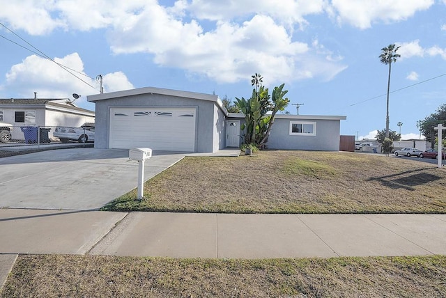 ranch-style home with a garage and a front yard