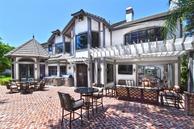 view of patio with area for grilling, an outdoor living space, a pergola, and french doors