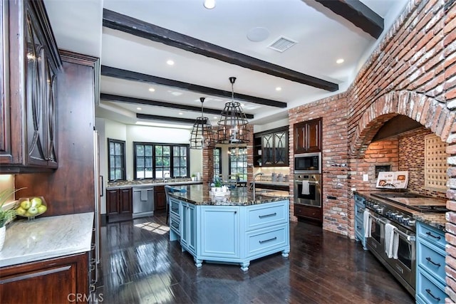 kitchen with stainless steel appliances, dark brown cabinets, and pendant lighting