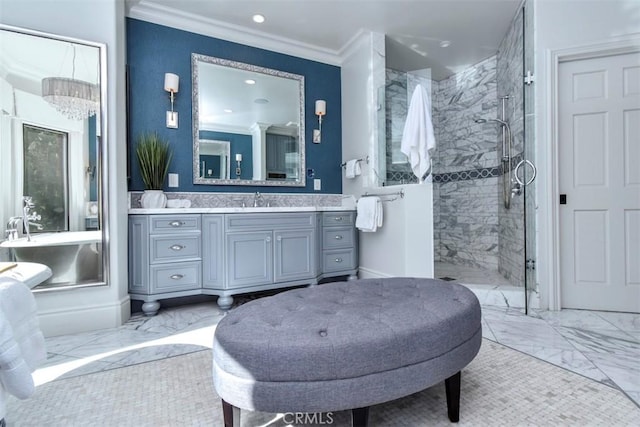 bathroom with ornamental molding, vanity, and a tile shower