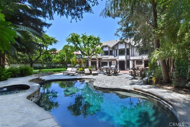 view of swimming pool with a patio area