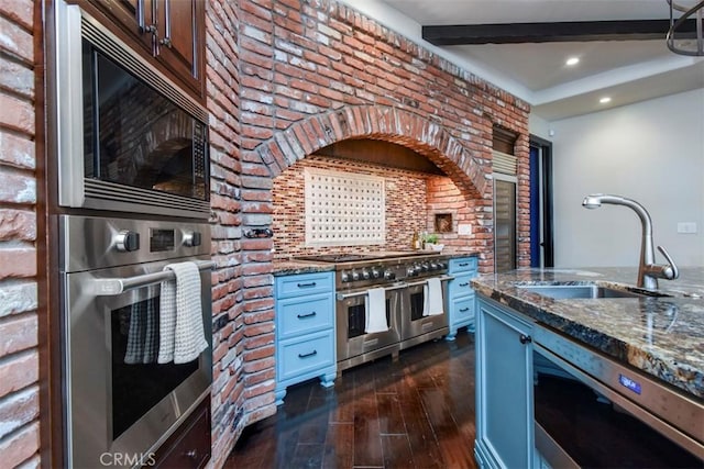 20514 Chatsboro Dr, Woodland Hills, CA 91364 - kitchen featuring stainless steel appliances, a sink, dark stone counters, dark wood-type flooring, and beamed ceiling