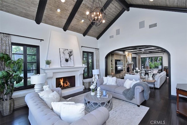 living room with an inviting chandelier, high vaulted ceiling, wooden ceiling, dark hardwood / wood-style floors, and beam ceiling