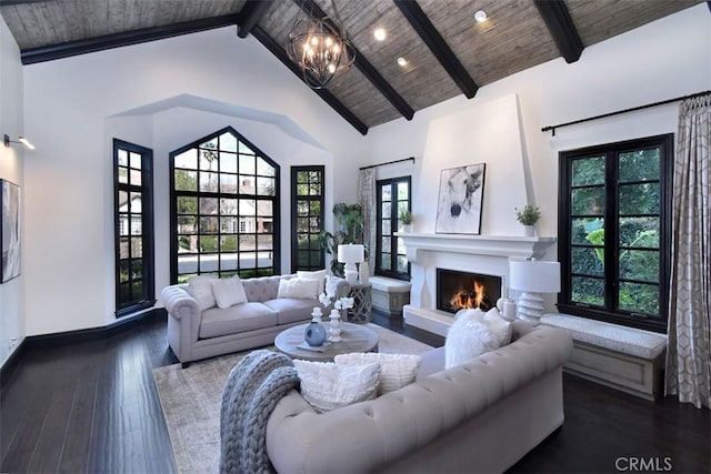 living room with hardwood / wood-style floors, high vaulted ceiling, a chandelier, wooden ceiling, and beam ceiling