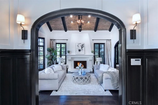 living room featuring wood ceiling, dark hardwood / wood-style floors, and lofted ceiling with beams