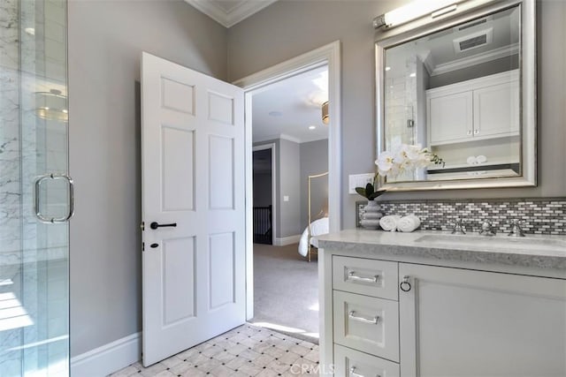 bathroom featuring tasteful backsplash, crown molding, a shower with door, and vanity