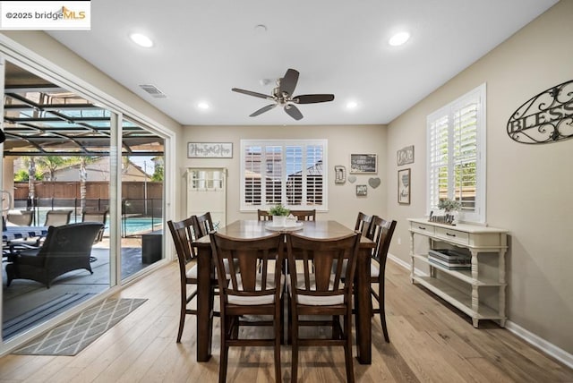 dining area with ceiling fan, light hardwood / wood-style floors, and a wealth of natural light