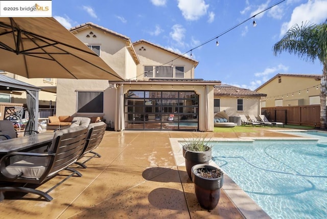 view of pool with an outdoor hangout area and a patio area