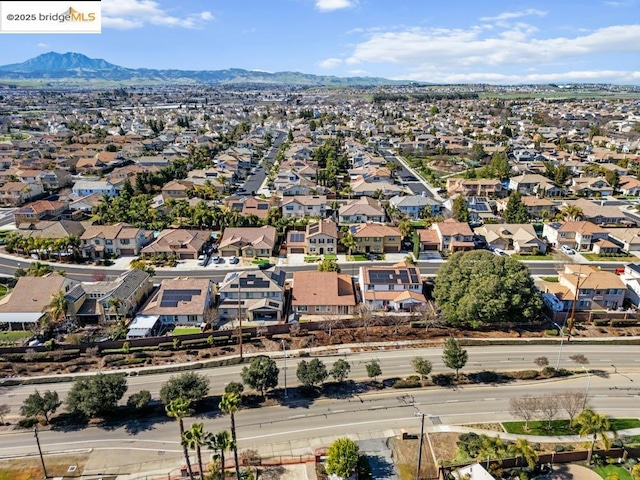 birds eye view of property featuring a mountain view