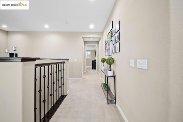 corridor with light colored carpet