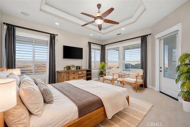 bedroom with access to outside, a raised ceiling, visible vents, and carpet flooring