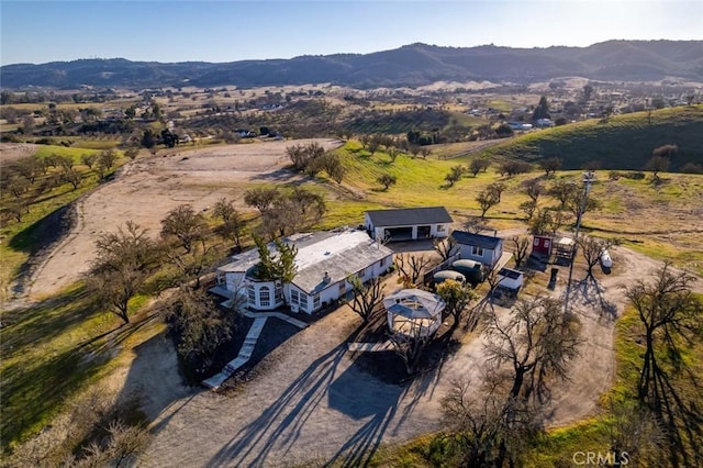 birds eye view of property featuring a mountain view