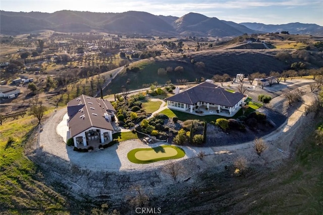 birds eye view of property with a mountain view