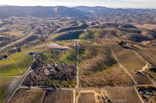 birds eye view of property with a mountain view and a rural view