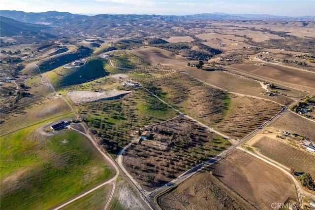 drone / aerial view featuring a rural view and a mountain view