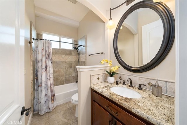 full bath featuring shower / bath combo, vanity, toilet, and tile patterned floors