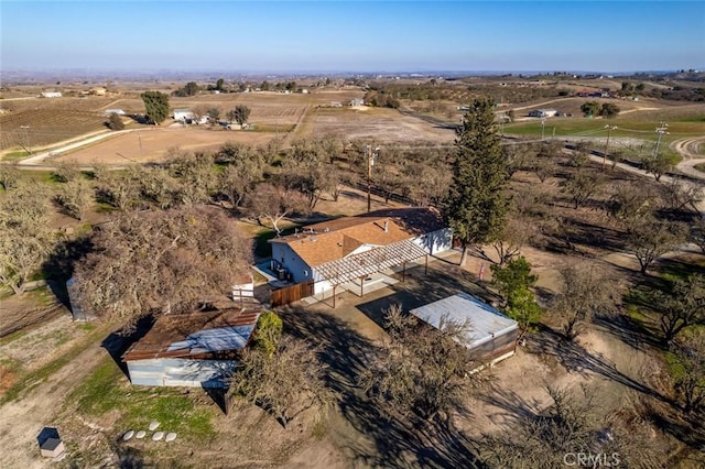 birds eye view of property featuring a rural view