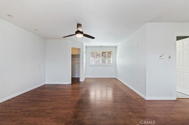 unfurnished room featuring ceiling fan and dark hardwood / wood-style flooring