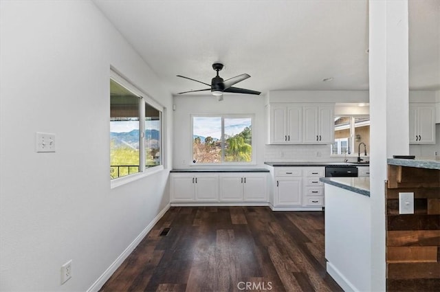 kitchen featuring backsplash, dark wood-type flooring, white cabinets, and ceiling fan