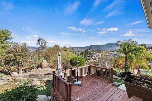 wooden terrace featuring a mountain view