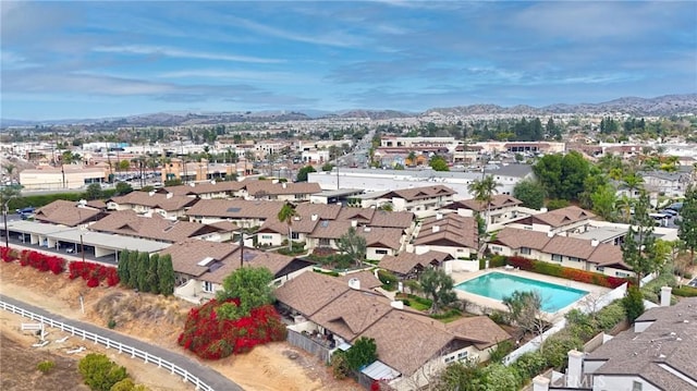 birds eye view of property featuring a mountain view