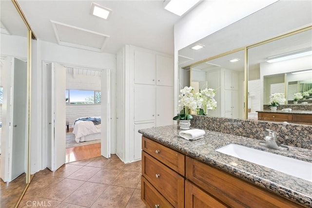 bathroom with vanity and tile patterned floors