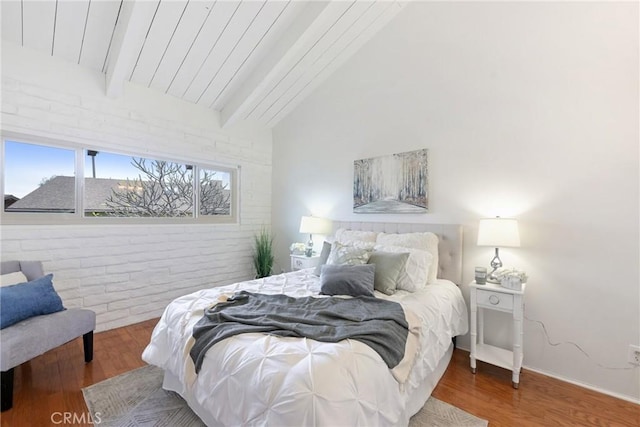 bedroom featuring hardwood / wood-style flooring, wood ceiling, brick wall, and vaulted ceiling with beams