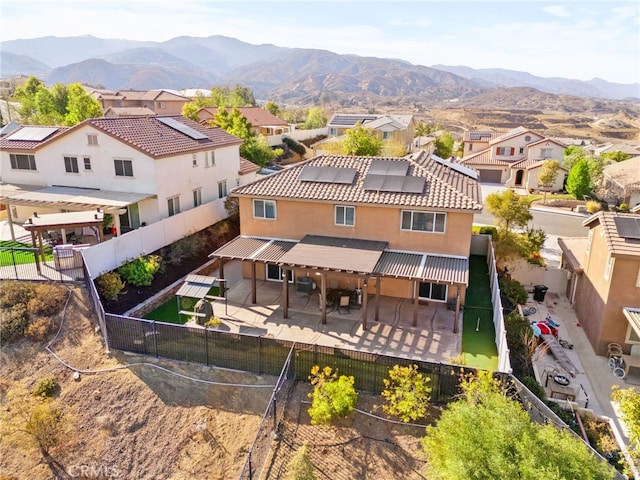 birds eye view of property with a mountain view