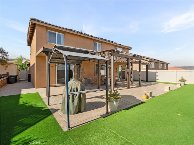 rear view of house with a patio and a pergola