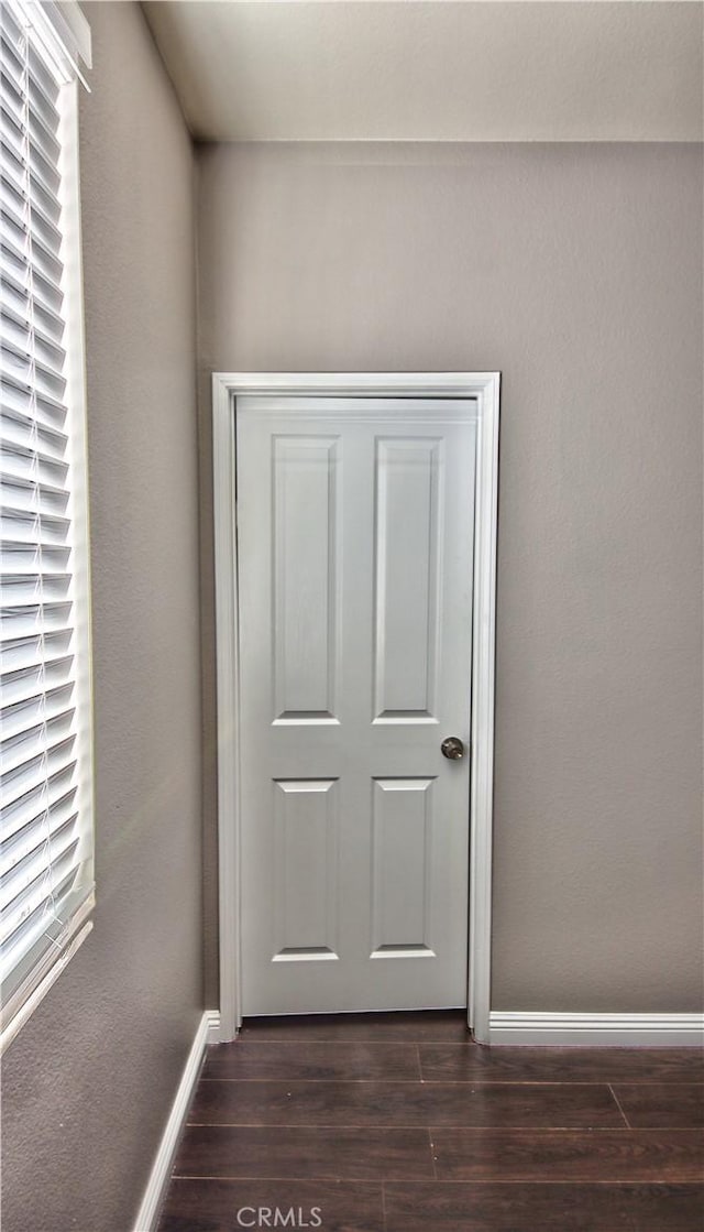 doorway featuring dark hardwood / wood-style floors