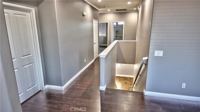 hallway with dark hardwood / wood-style floors