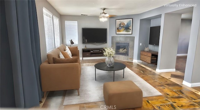 living room featuring a fireplace and a notable chandelier