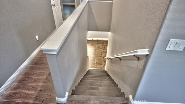 stairs featuring hardwood / wood-style flooring