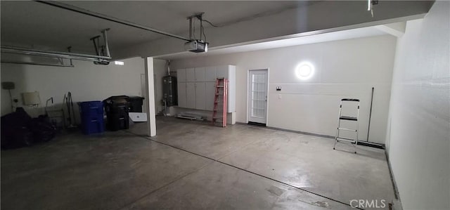 garage featuring a garage door opener and water heater