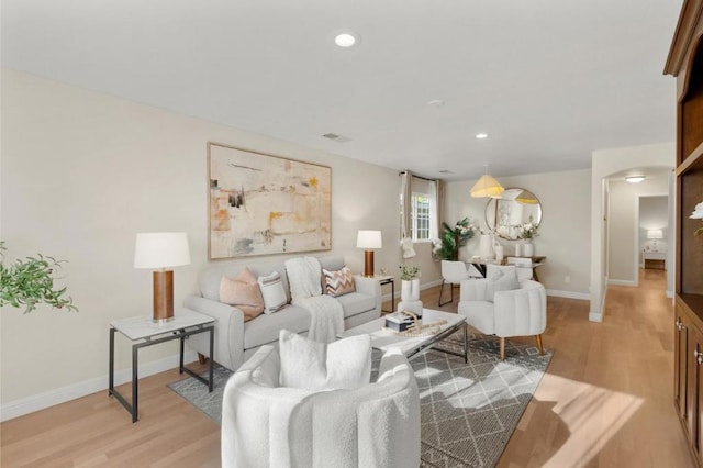 living room with light hardwood / wood-style floors