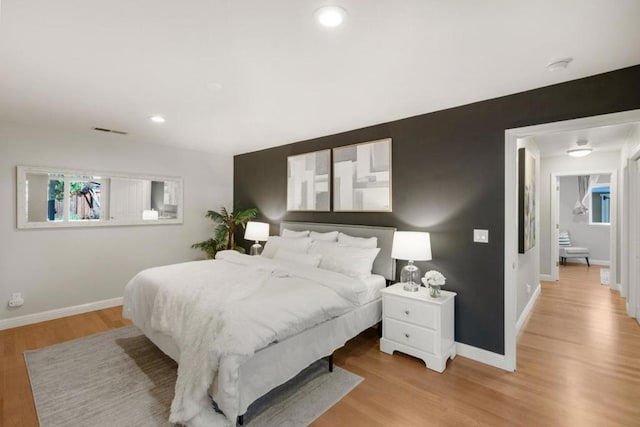 bedroom with light wood-type flooring