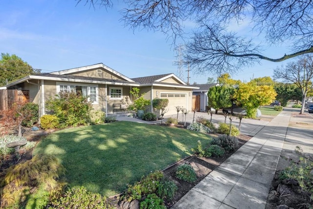 view of front facade with a garage and a front lawn