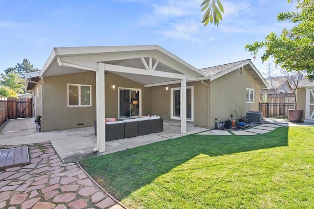 rear view of house featuring an outdoor living space, a yard, central air condition unit, and a patio area