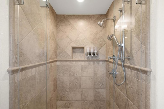 bathroom with a tile shower