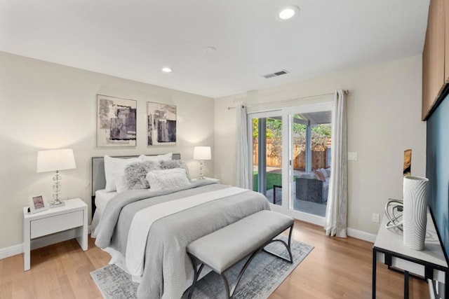 bedroom featuring access to outside and light wood-type flooring