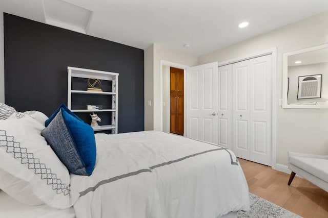 bedroom featuring hardwood / wood-style flooring and a closet