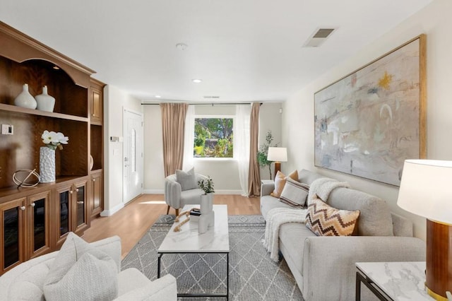 living room with light hardwood / wood-style floors