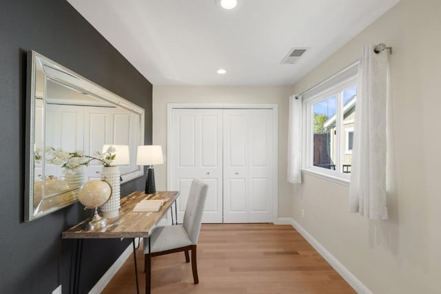 home office with light wood-type flooring