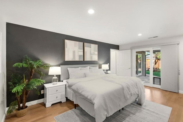 bedroom featuring access to outside and light wood-type flooring