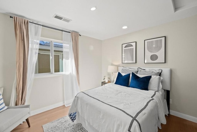 bedroom with wood-type flooring