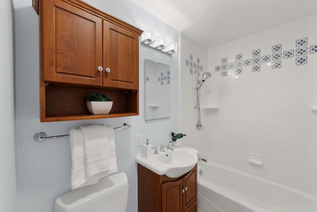 full bathroom with bathing tub / shower combination, vanity, and toilet