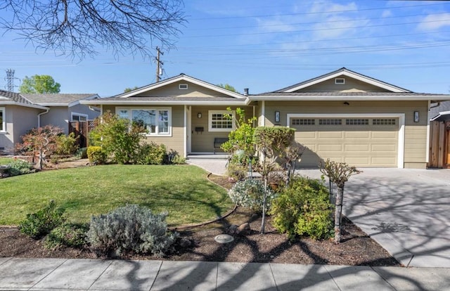 ranch-style house featuring a garage and a front yard