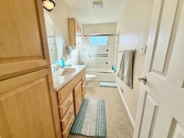 full bathroom with vanity, tile patterned floors, shower / bath combination with glass door, and toilet